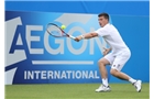 EASTBOURNE, ENGLAND - JUNE 14: Ken Skupski of Great Britain plays a forehand against Remi Boutillier of France during their Men's Singles qualifying match on day one of the Aegon International at Devonshire Park on June 14, 2014 in Eastbourne, England.  (Photo by Steve Bardens/Getty Images)